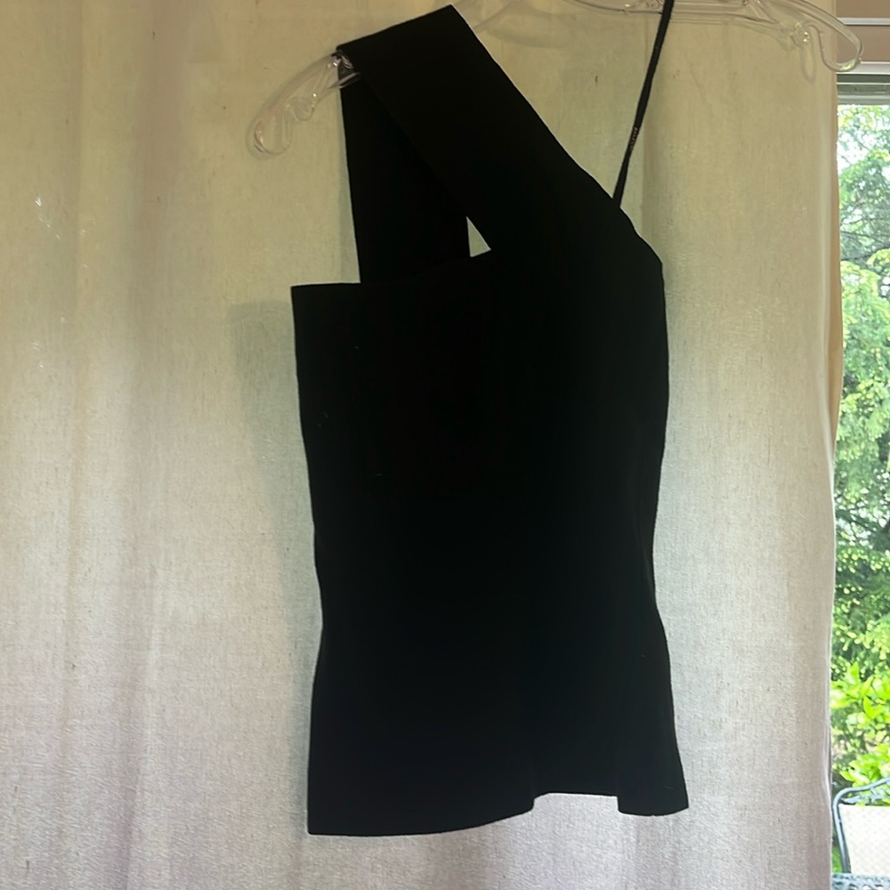 Black one shoulder knit top. Soft. Stretchy. Can dress it up or down. Like new.